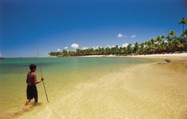 Praia Toquinho. Na maré baixa, a barreira de pedras forma uma boa piscina natural Praia Toquinho. Na maré baixa, a barreira de pedras forma uma boa piscina natural