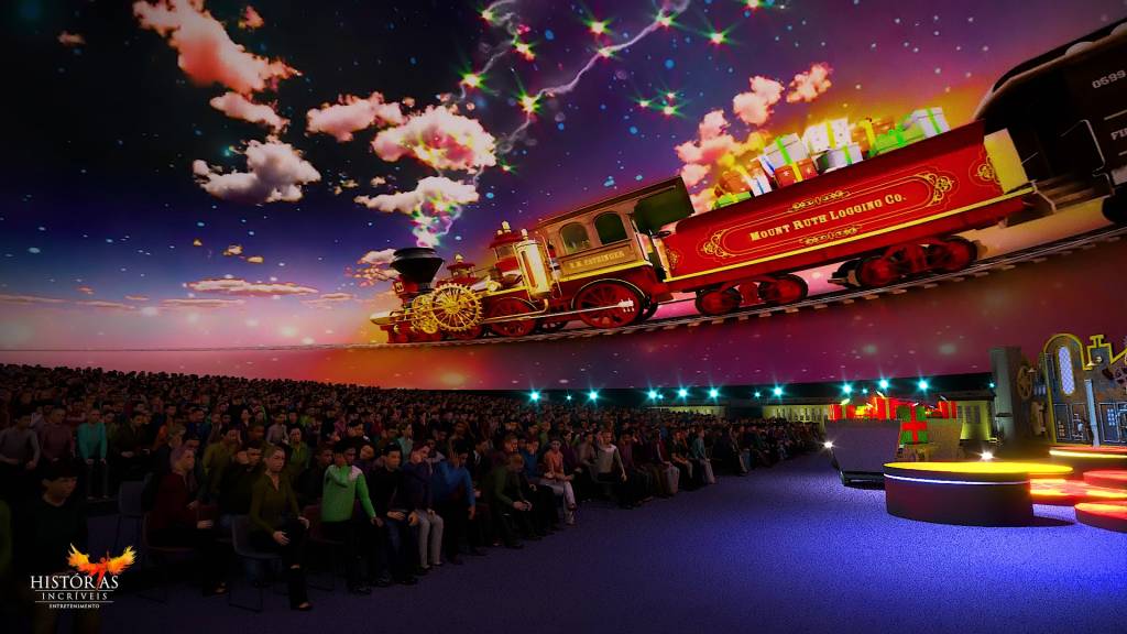Projeto do Mega Domo, Viagem de Natal, em Canela, Rio Grande do Sul A imagem mostra um projeto com pessoas em um auditório e um trem sendo projetado na parede
